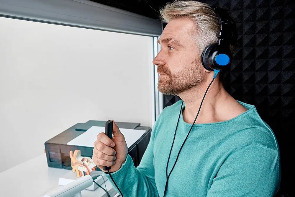 man taking hearing test