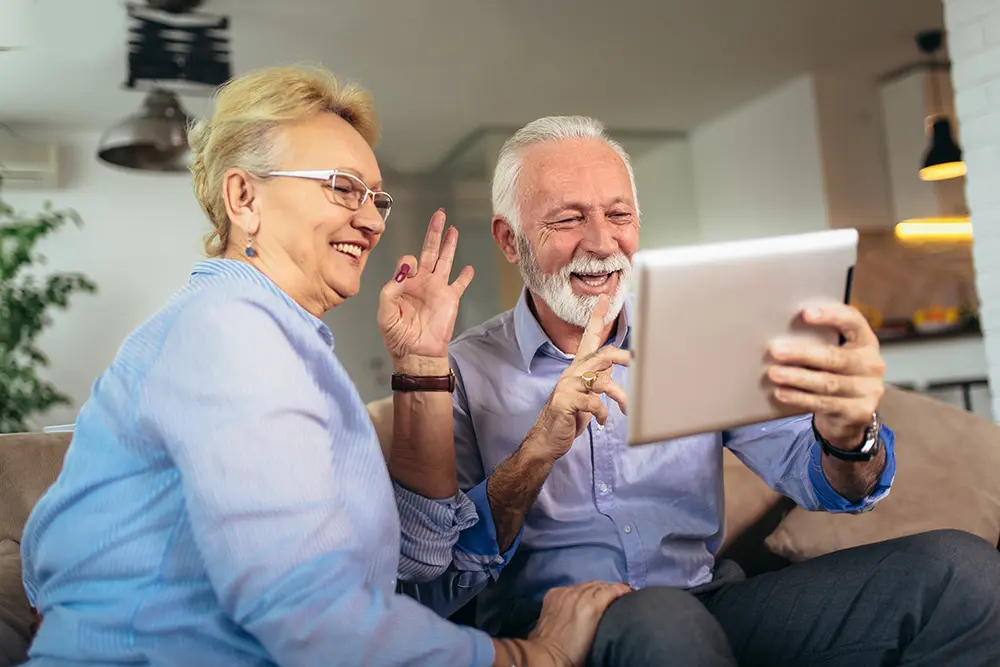 happy senior couple using a tablet