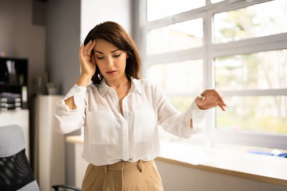 woman experiencing dizziness