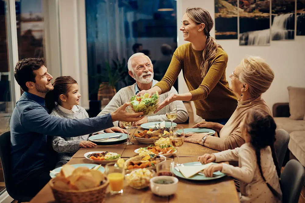 Happy multi-generation family enjoying in a lunch together at home.